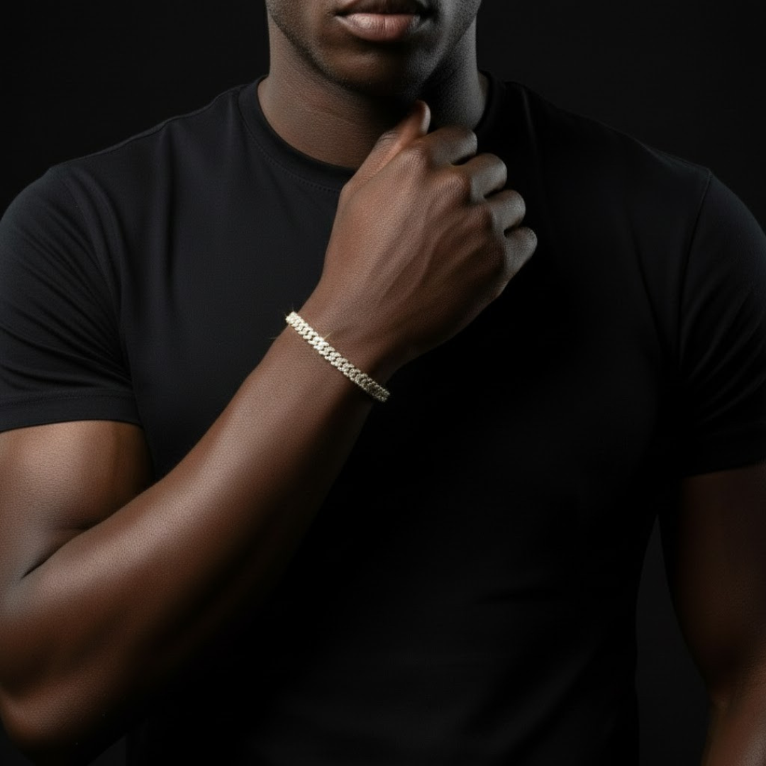 Man wearing ROYAL ICE VVS1 18K Gold Cuban bracelet on wrist, showcasing elegance and luxury.